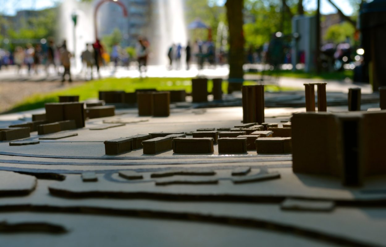 A neighbourhood model in the foreground, and a park in the background