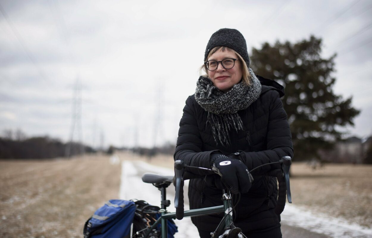 Nancy Smith Lea poses with her bicycle on a hydro corridor path in Willowdale
